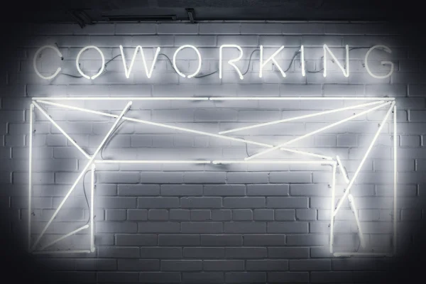 closeup photo of Co Working neon light sign