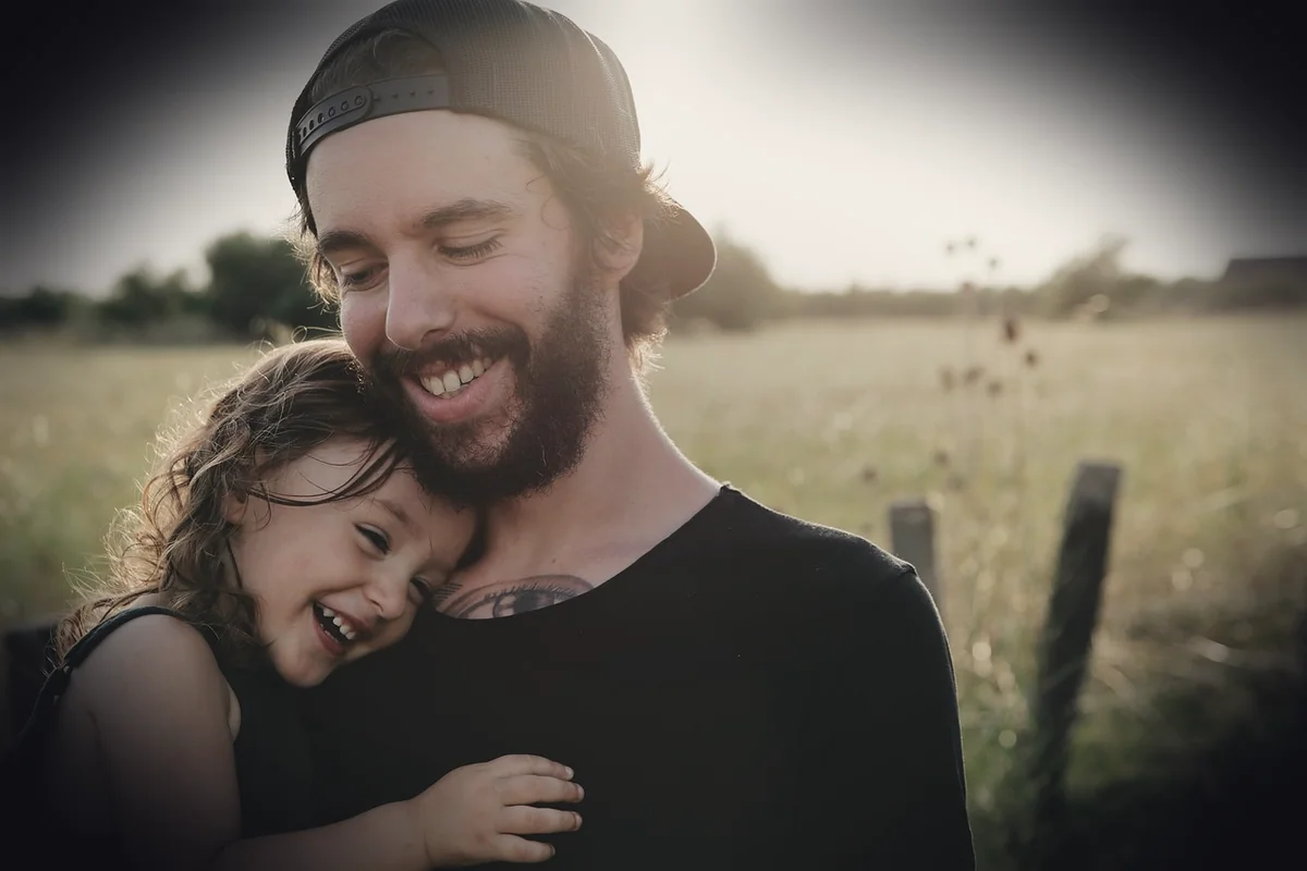 people, father, daughter, smile, happy, hug, carry, love, field, beard, cap, child, outdoors, countryside, happiness, fathers