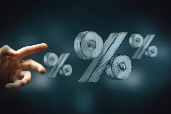 Hand reaching towards floating percentage symbols.