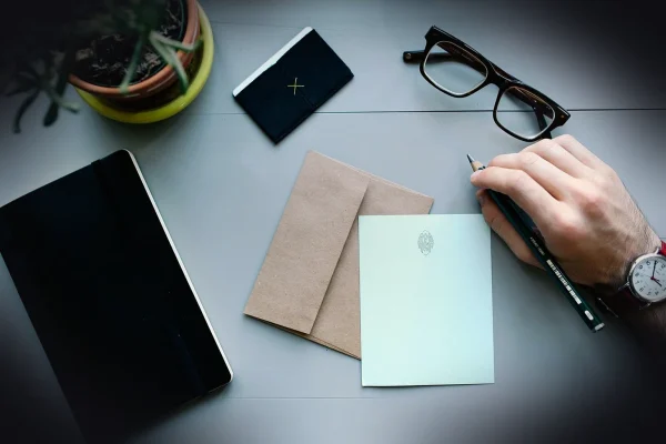 hand, man, watch, work, desk, workspace, people, business, male, person, businessman, letter, envelope, pen, writing, no