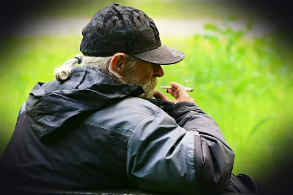 man, elderly, smoking, sitting, relaxing, cigarette, thoughtful, pensive, editorial