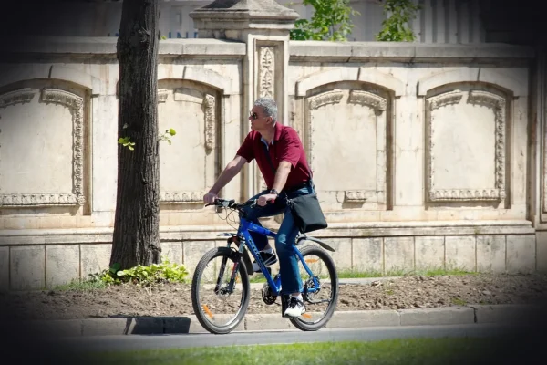 bike, man, glasses, the person, while riding, the street, fence, wall, nature, lawn, spring, urban