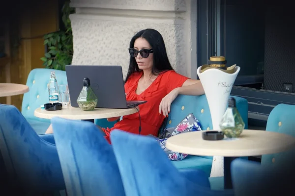 woman, work from anywhere, cafe, working, casual, sunglasses, stand, outdoor, laptop, remote work, lifestyle, remote wor