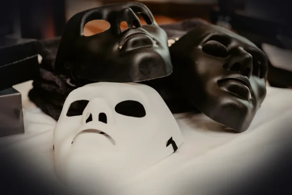 white and black mask on white textile