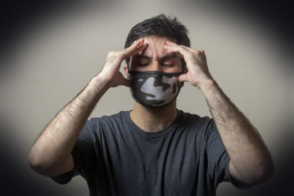 man in black crew neck t-shirt wearing black and white mask