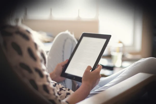 kindle, ereader, tablet, e-reader, ebook, e-book, adult, blur, chair, home, indoors, learning, leisure, living room, mod