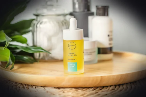 white and yellow plastic bottle on brown wooden table