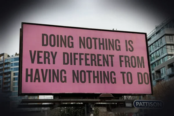 a large pink billboard with a quote on it
