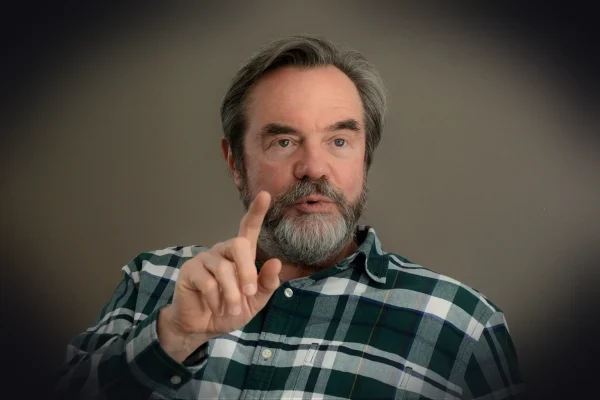 counselor, wellness coach, man, pointing, beard, green eyes, speaker, lecturer, teacher, professor, coaching, business,
