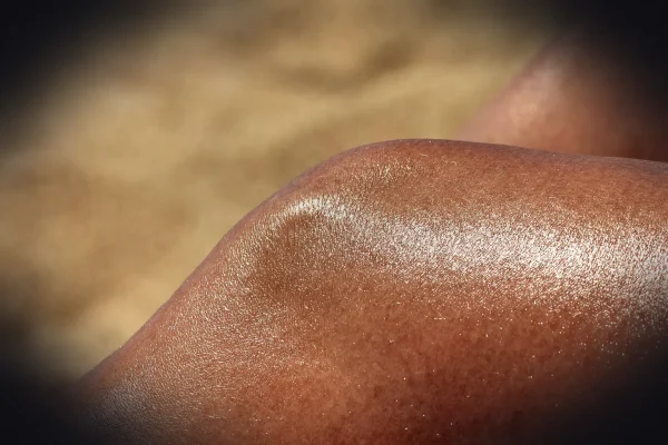 a close up of a person's tanning legs
