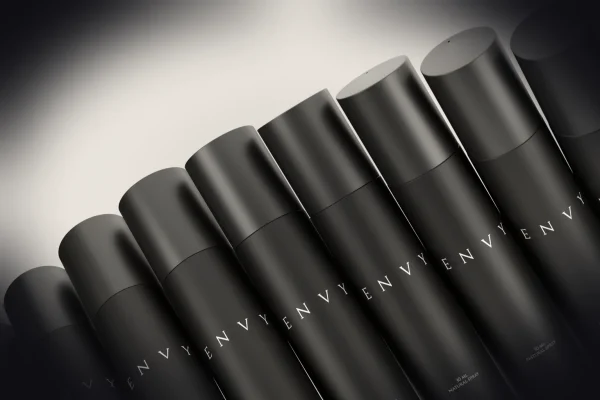 Black bottles are arranged in a diagonal row.