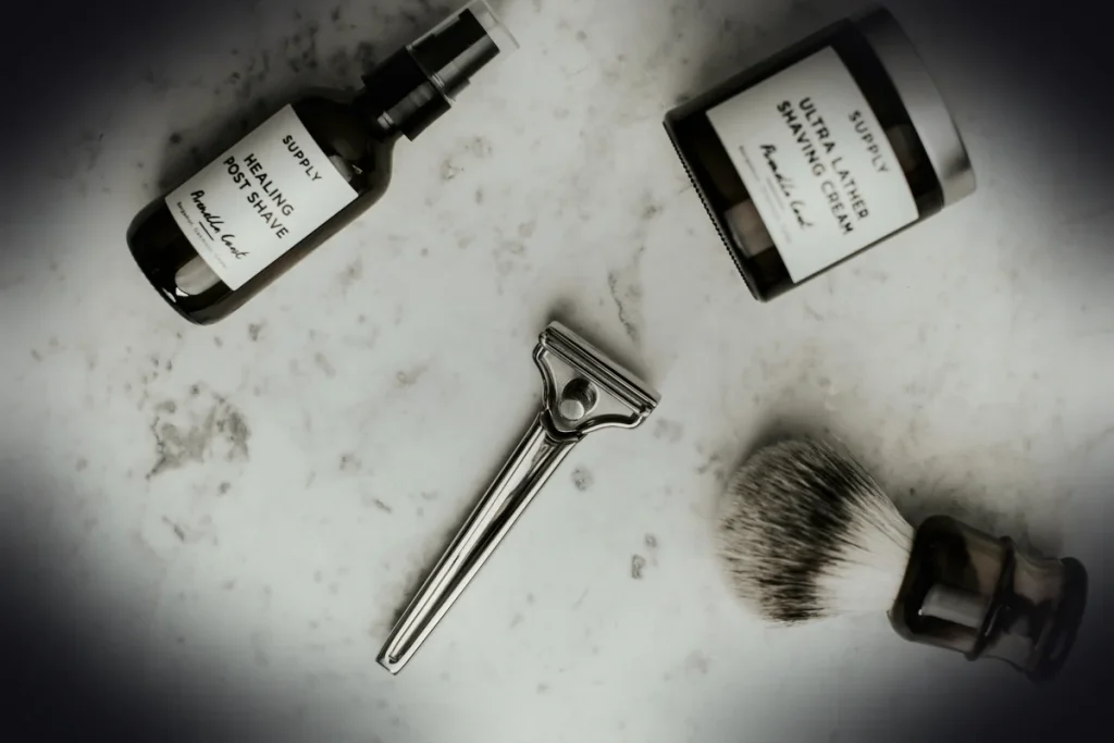 shaving cream bottle and silver portable shaver